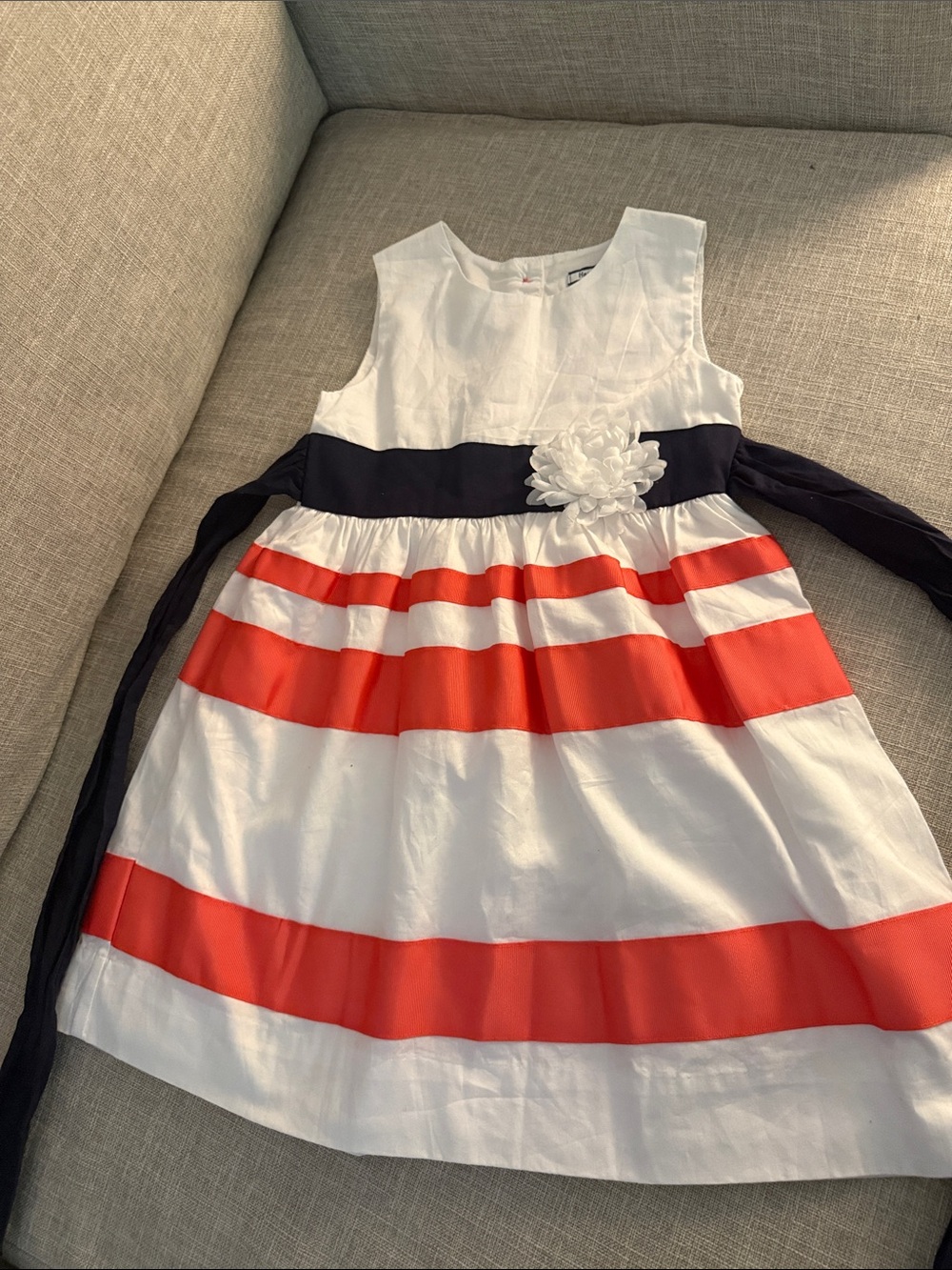 Hartstrings White Dress with Coral Stripes and Navy Sash Flower